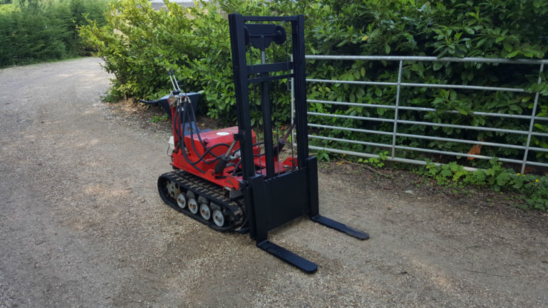 Photo 3 for a MINI TRACKED FORKLIFT SKIDSTEER LOADER PALLET TRUCK ...